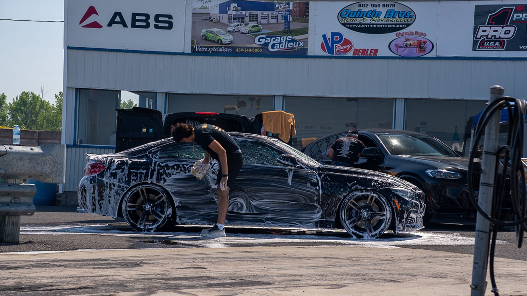 A car being washed with the MVISION flag